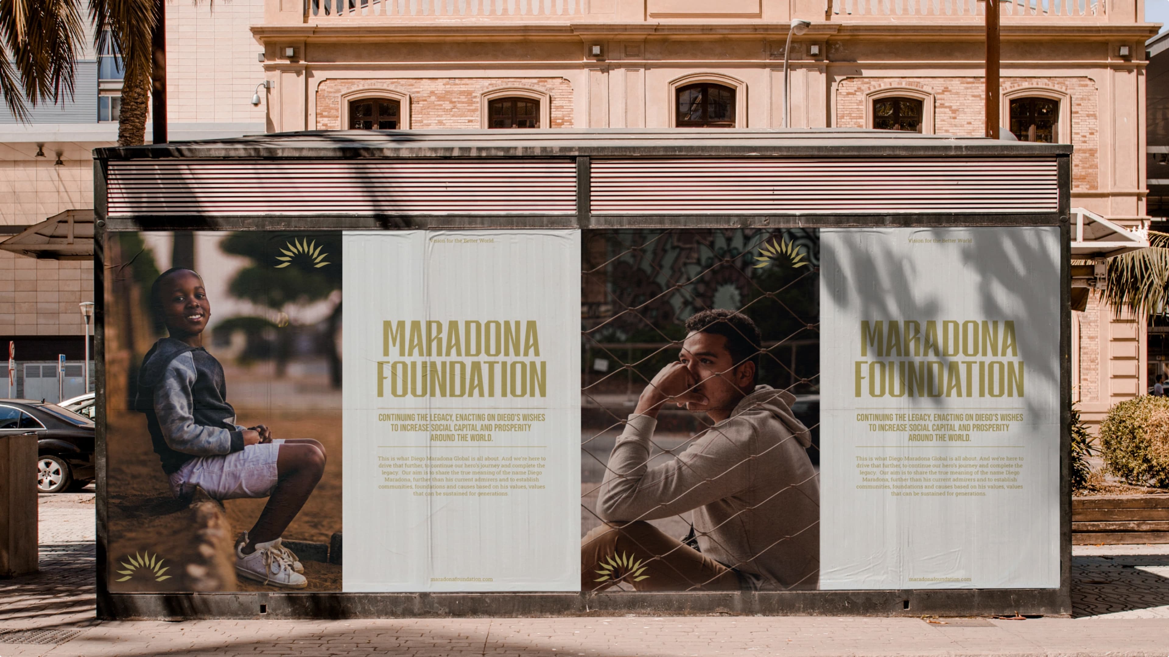 Bus stop advertisement for the Maradona Foundation, featuring two panels: a smiling young boy seated outdoors, and a young man in contemplation behind a chain-link fence, with the tagline "Continuing the legacy, enacting on Diego's wishes to increase social capital and prosperity around the world."