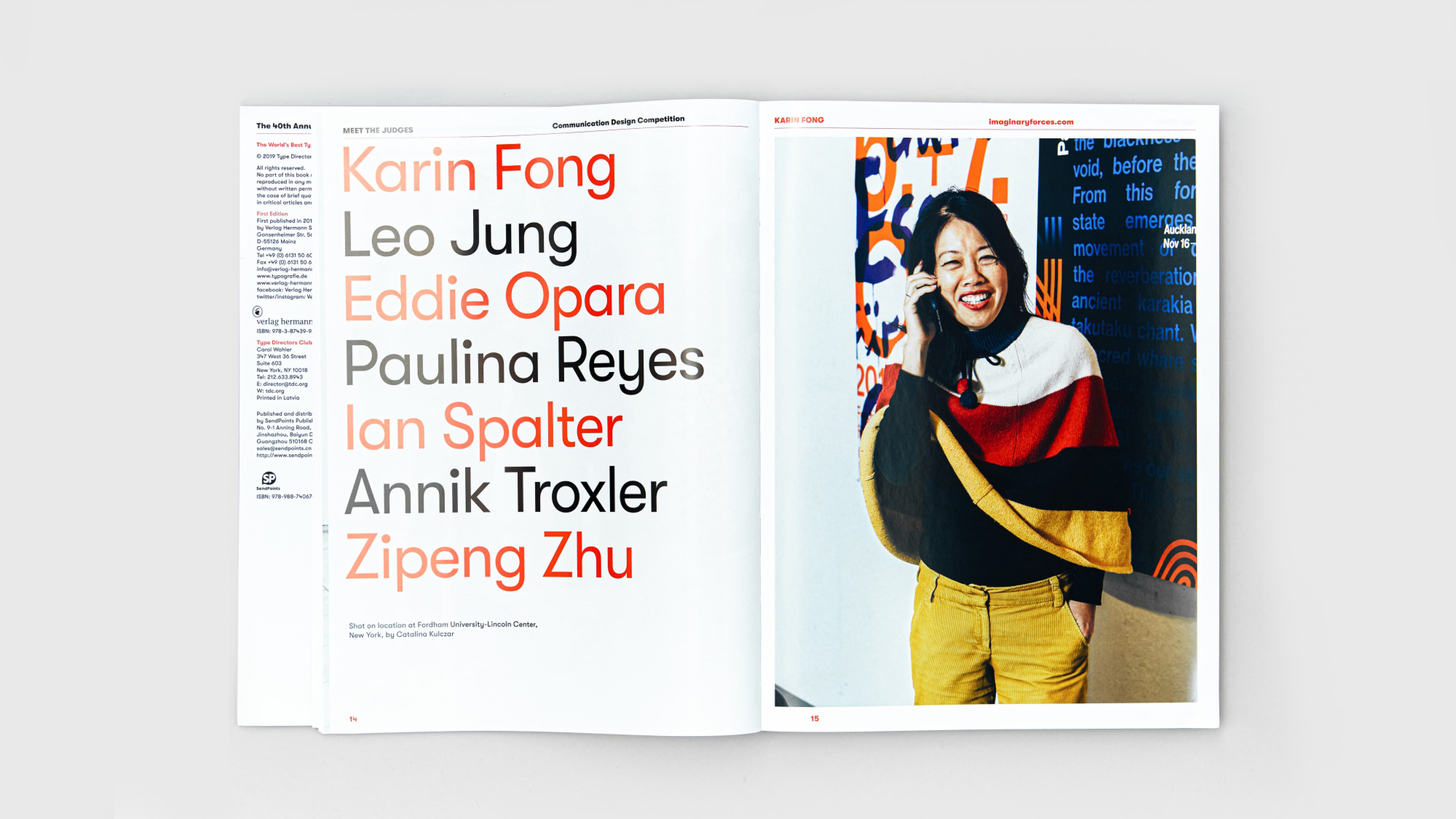 Open magazine spread showing "Meet the Judges" page listing names including Karin Fong, Leo Jung, Eddie Opara, and others in red and black type, alongside a portrait of Karin Fong smiling and holding a phone, wearing a colorful striped sweater and mustard trousers.