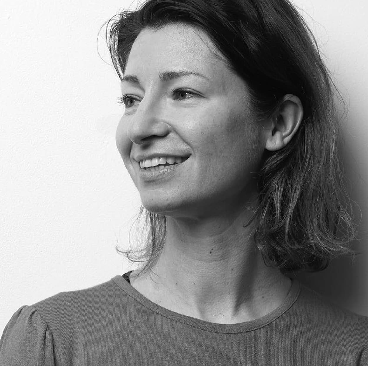 Marge smiling, looking off to the side