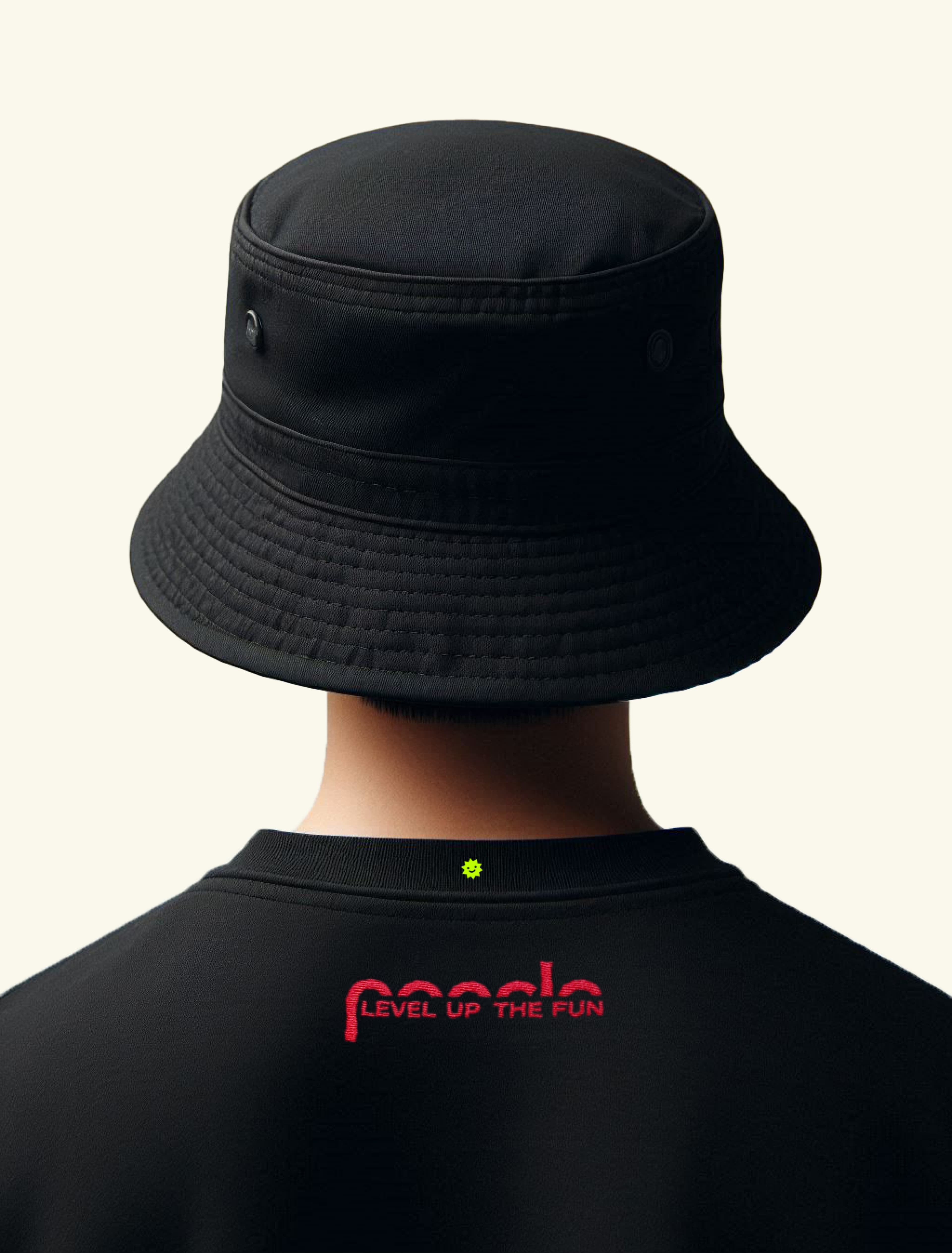 Person viewed from behind wearing a black bucket hat and black shirt, with "poncle – LEVEL UP THE FUN" embroidered in red on the back and a small yellow sun icon near the collar.