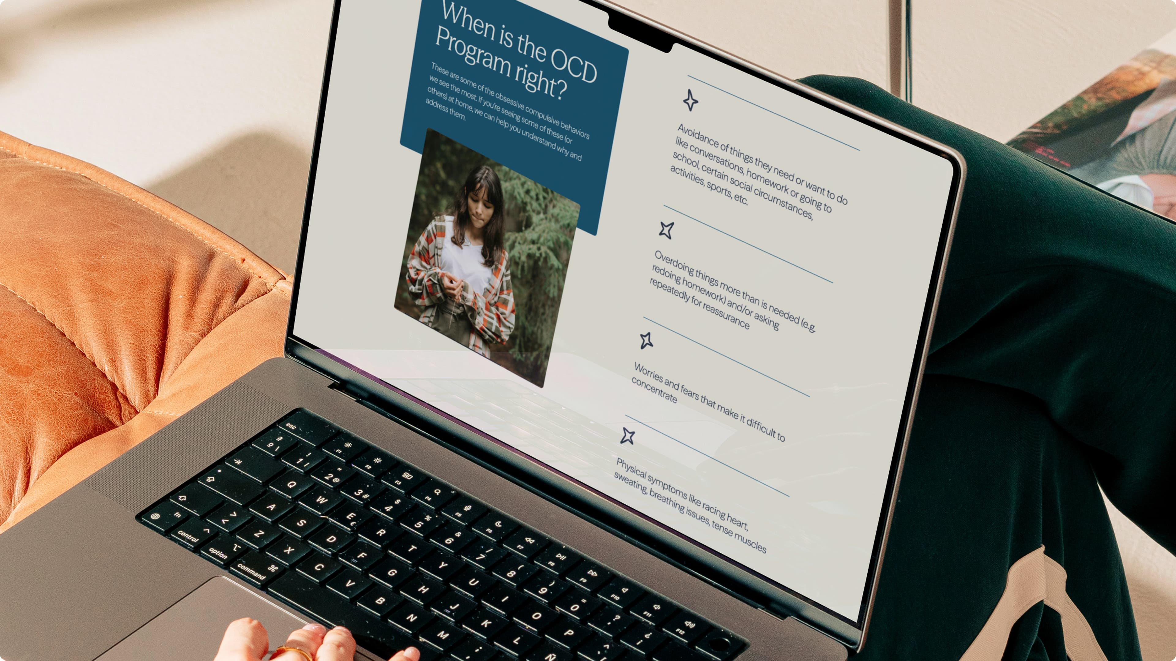 Laptop on a leather sofa displaying a slide titled "When is the OCD Program right?" listing OCD signs including avoidance, repetitive behaviors, concentration difficulties, and physical symptoms.